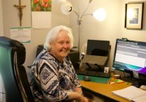 School Sister of Notre Dame Kathleen Storms, who is leading efforts to coordinate pilgrimages for the Laudato Si’ Movement Minnesota Chapter, works from her West St. Paul home Aug. 25 as she helps prepare for upcoming pilgrimages.