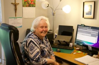 School Sister of Notre Dame Kathleen Storms, who is leading efforts to coordinate pilgrimages for the Laudato Si’ Movement Minnesota Chapter, works from her West St. Paul home Aug. 25 as she helps prepare for upcoming pilgrimages.