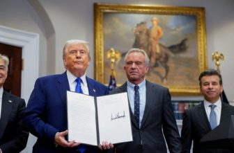 U.S. President Donald Trump holds an executive order on prescription drug pricing next to U.S. Health and Human Services Secretary Robert F. Kennedy, Jr., during a news conference in the Roosevelt Room at the White House in Washington May 12, 2025.
