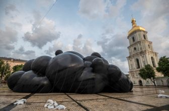 The "Black Cloud" installation by Ukrainian artist Oleksiy Sai (Liosha Say) is displayed near Holy Wisdom Cathedral, or St. Sophia Cathedral, in central Kyiv June 8, 2025. The cathedral was damaged in large-scale Russian drone attack on Kyiv and Odesa June 10 that killed up to seven people and injured up to 13 others. In a chilling evocation of Russia's all-out invasion of Ukraine since February 2022, the art installation includes the sounds of artillery fire, explosions, drones and military vehicles.