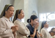 Religious sisters and others pray during Mass Aug. 6, 2025, at the World Peace Memorial Cathedral in Hiroshima, Japan, for the victims of the 1945 atomic bombing. The Mass was part of a "Pilgrimage of Peace" by four U.S. archbishops and U.S. Catholic university leaders and students to Hiroshima and Nagasaki to pray and dialogue for peace on the 80th anniversary of when the atomic bombs were dropped on those cities on Aug. 6 and 9, 1945.