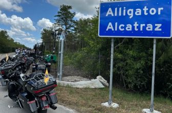 Archbishop Thomas G. Wenski of Miami and Knights on Bikes pray the rosary for detainees at the entrance to Alligator Alcatraz, a controversial immigration detention facility in some 55 miles from Miami in the Florida Everglades, July 20, 2025.