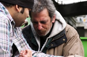 Praying with homeless